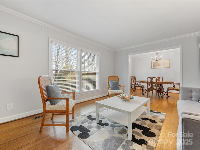 living room featuring visible vents, light wood-style flooring, crown molding, and baseboards