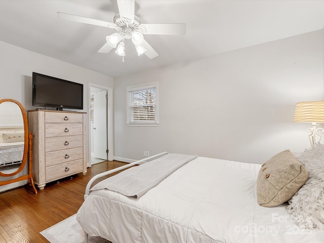 bedroom featuring wood finished floors and a ceiling fan