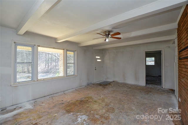 empty room with beamed ceiling