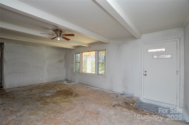 foyer with beam ceiling, a ceiling fan, and ornamental molding