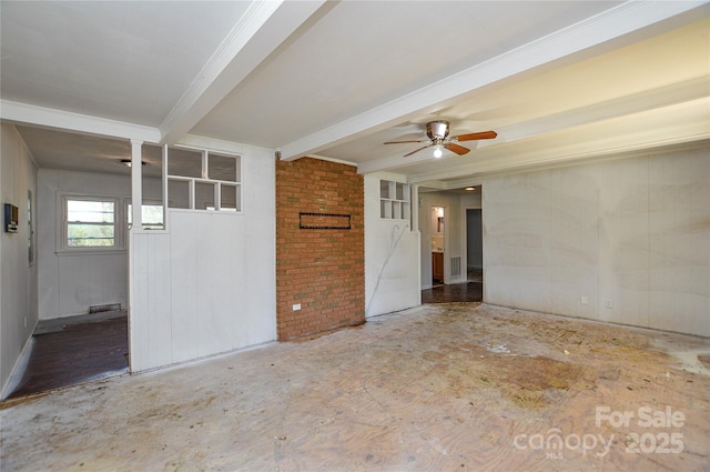 empty room with beamed ceiling, a ceiling fan, and visible vents