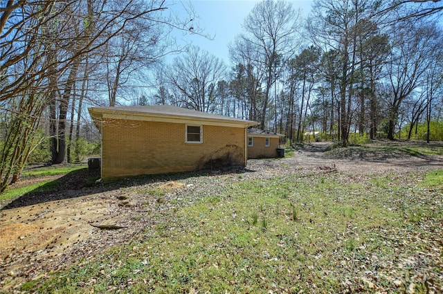 view of property exterior featuring brick siding