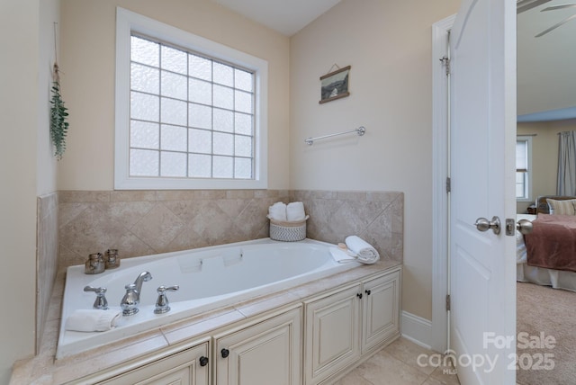 ensuite bathroom with a bath and ensuite bathroom