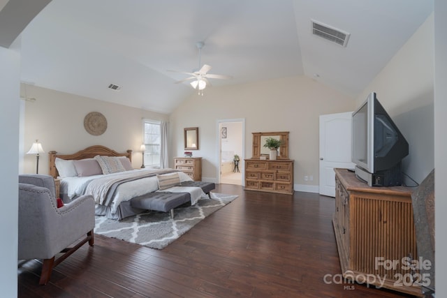 bedroom with vaulted ceiling, visible vents, and dark wood-style flooring