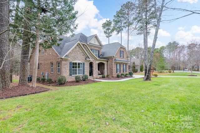 303 Ridge Reserve Dr Unit 29, Clover, SC 29710 - craftsman-style home featuring a shingled roof, a front yard, and stone siding