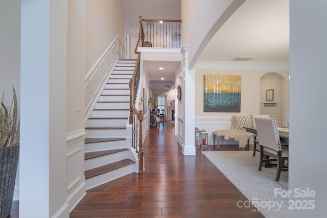303 Ridge Reserve Dr Unit 29, Clover, SC 29710 - entrance foyer featuring arched walkways, ornamental molding, stairway, hardwood / wood-style floors, and a decorative wall