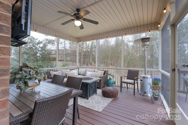303 Ridge Reserve Dr Unit 29, Clover, SC 29710 - sunroom with ceiling fan and an outdoor living space with a fire pit