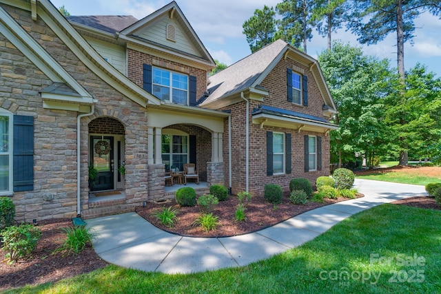 303 Ridge Reserve Dr Unit 29, Clover, SC 29710 - view of front of property with a porch, brick siding, stone siding, and a front lawn