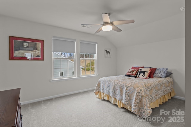 carpeted bedroom with lofted ceiling, a ceiling fan, and baseboards