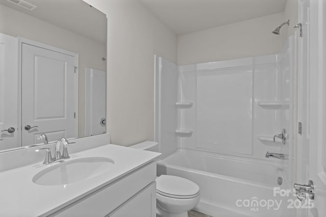 bathroom with bathing tub / shower combination, visible vents, toilet, and vanity