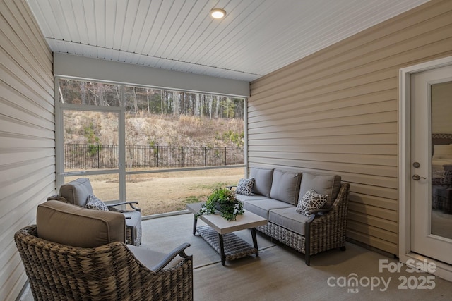 sunroom / solarium featuring a healthy amount of sunlight