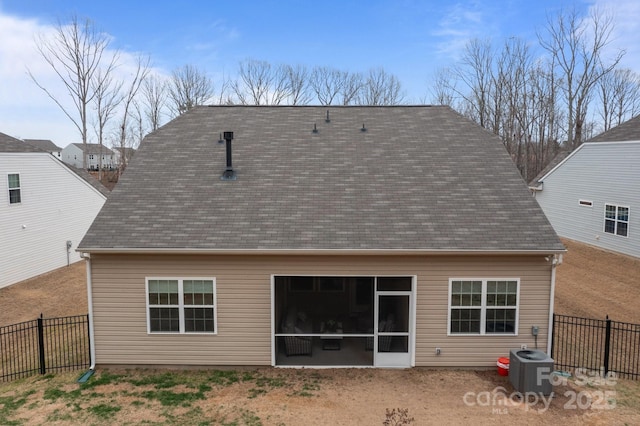 back of house with central air condition unit, fence, and a sunroom