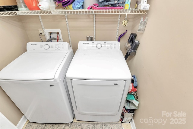 laundry area featuring laundry area and washing machine and clothes dryer