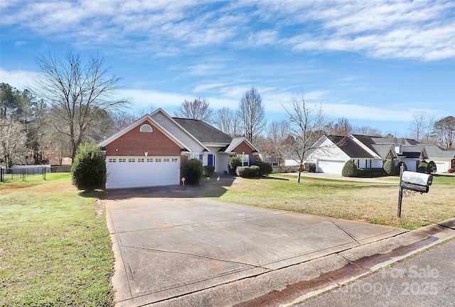 view of front of house with a front yard, fence, concrete driveway, a garage, and brick siding