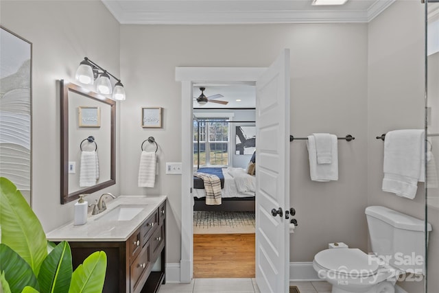 ensuite bathroom with toilet, ensuite bath, crown molding, ceiling fan, and vanity