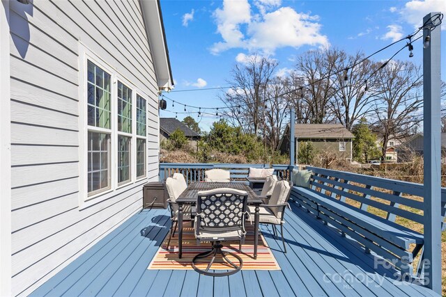 deck featuring outdoor dining area