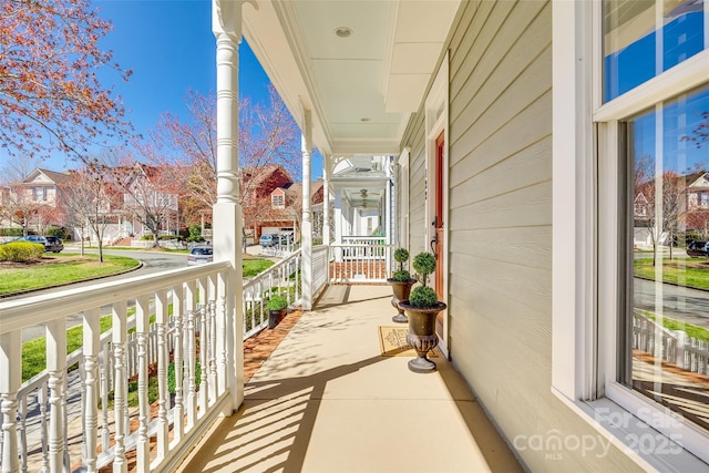 balcony featuring a residential view and a porch