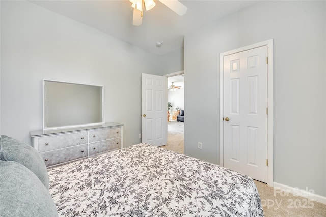 carpeted bedroom featuring baseboards and ceiling fan