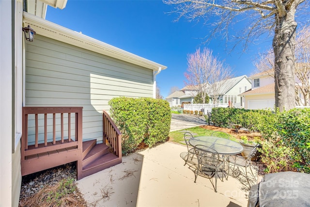 view of patio featuring a residential view and outdoor dining space