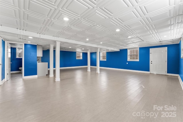 interior space featuring recessed lighting, an ornate ceiling, and baseboards