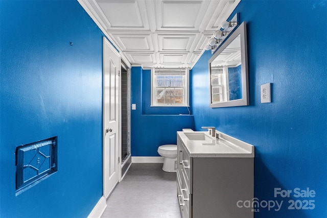 full bathroom featuring toilet, an ornate ceiling, baseboards, walk in shower, and vanity