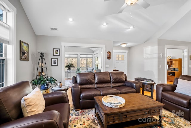 living area with vaulted ceiling, recessed lighting, a ceiling fan, and visible vents