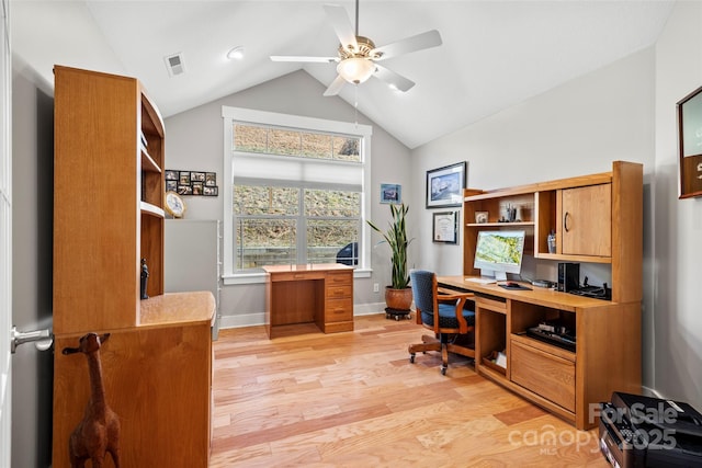 office area featuring visible vents, a ceiling fan, baseboards, light wood-style floors, and lofted ceiling