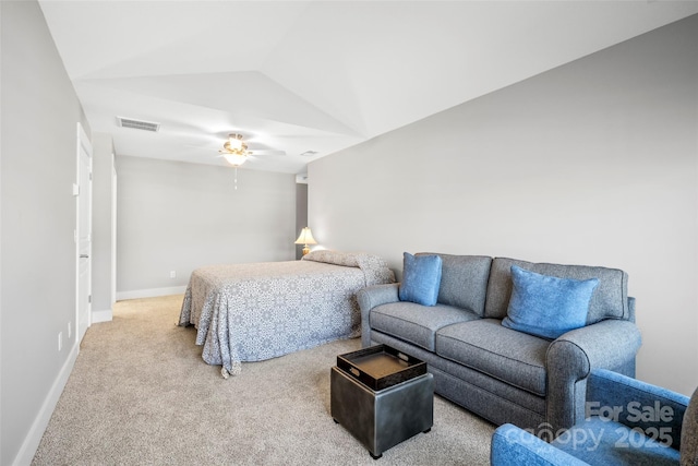 carpeted bedroom featuring visible vents, ceiling fan, baseboards, and vaulted ceiling