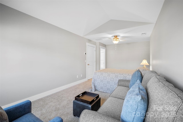 living area with visible vents, baseboards, ceiling fan, lofted ceiling, and carpet flooring