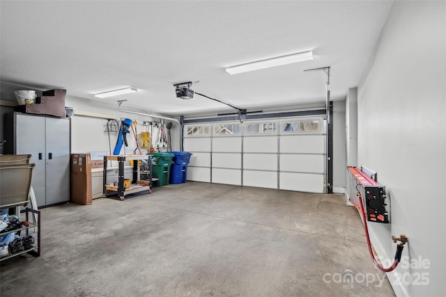 garage featuring a garage door opener