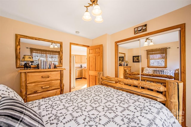 bedroom with an inviting chandelier