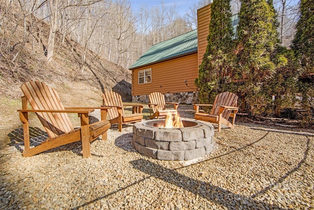 view of patio with a fire pit