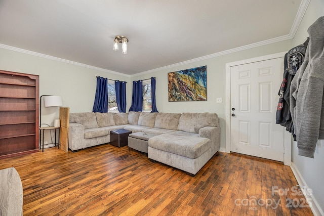 living room featuring baseboards, hardwood / wood-style floors, and crown molding