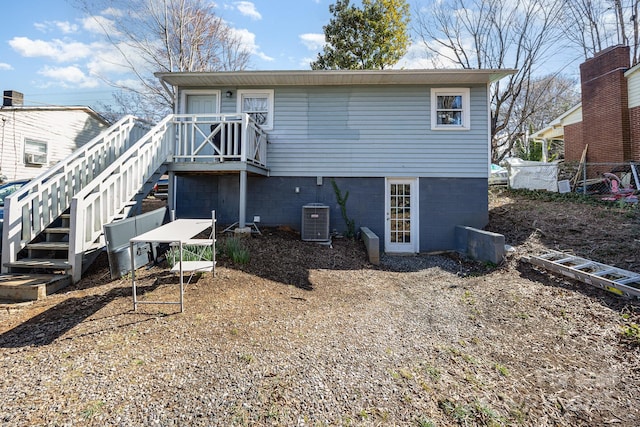 rear view of property featuring central air condition unit