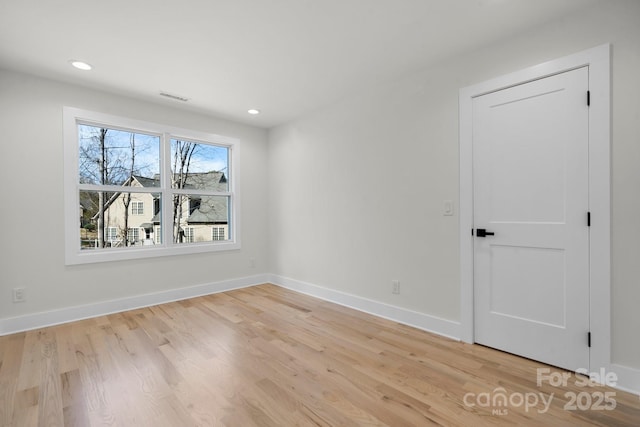 spare room with recessed lighting, visible vents, baseboards, and light wood-style flooring