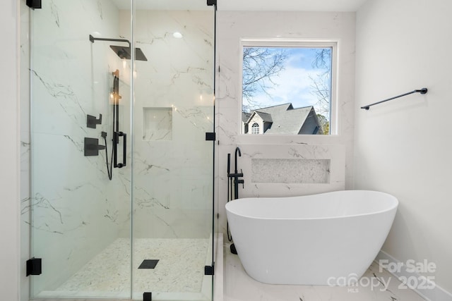 bathroom with a soaking tub, marble finish floor, and a marble finish shower