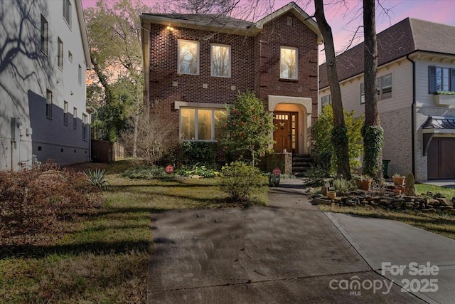 view of front of house with brick siding