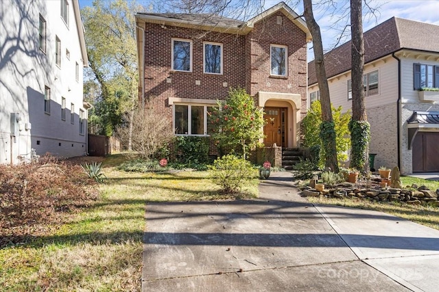 view of front of house featuring brick siding