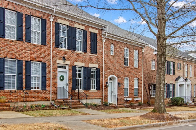 view of property with brick siding