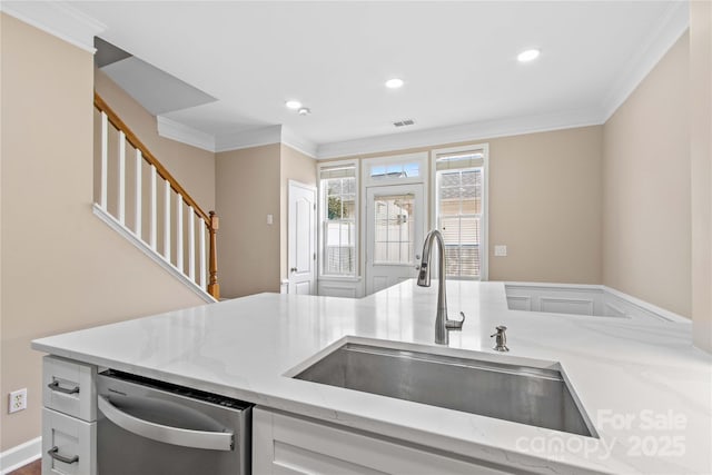 kitchen featuring a sink, light stone counters, stainless steel dishwasher, and crown molding