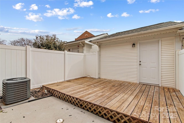 deck featuring central air condition unit and fence