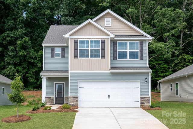 craftsman-style home with a front lawn, an attached garage, stone siding, and driveway