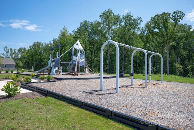 community jungle gym with a lawn