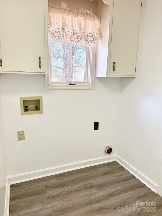 laundry room featuring hookup for a washing machine, wood finished floors, baseboards, hookup for an electric dryer, and cabinet space