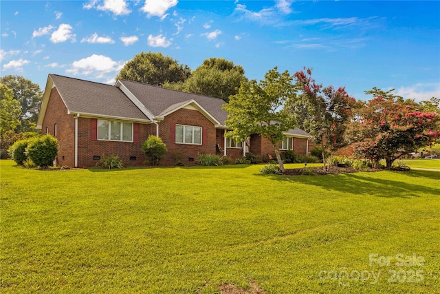 single story home featuring a front yard, brick siding, roof with shingles, and crawl space