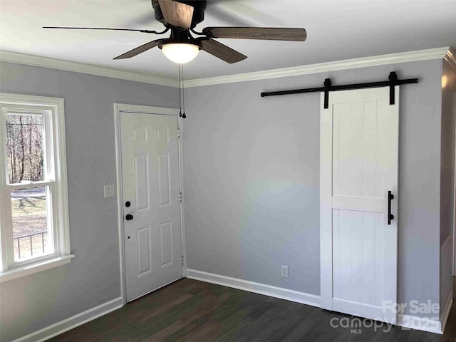 entrance foyer with ceiling fan, dark wood-type flooring, baseboards, and ornamental molding