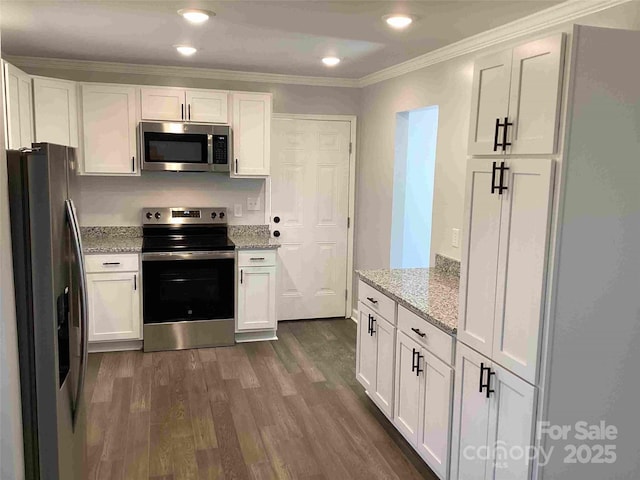 kitchen featuring white cabinets, dark wood-style flooring, and stainless steel appliances