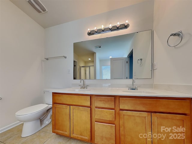 full bathroom featuring tile patterned floors, visible vents, and a sink