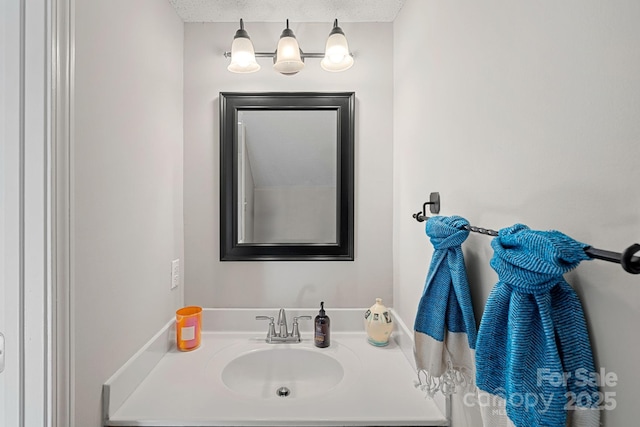 bathroom featuring vanity and a textured ceiling