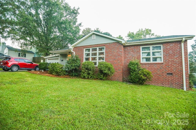 single story home with brick siding, a front lawn, and a garage